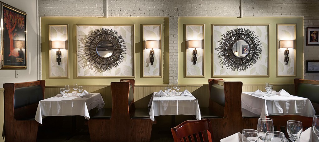 Side profile of fine dining restaurant booths with elegant decor.